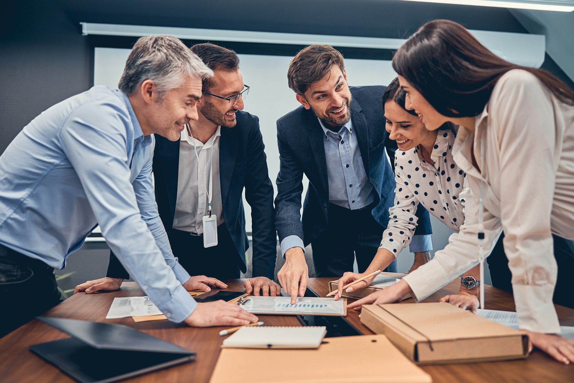 Group of expert dressed in formal wear developing advertising campaign